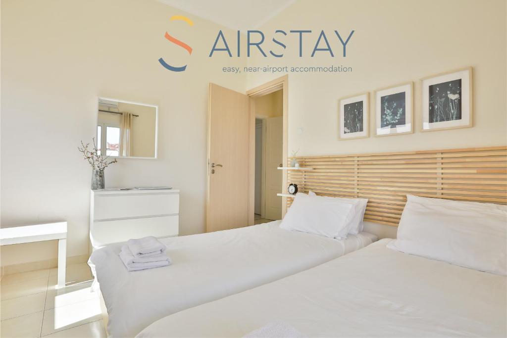 Postel nebo postele na pokoji v ubytování Nautilus Apartments Airport by Airstay