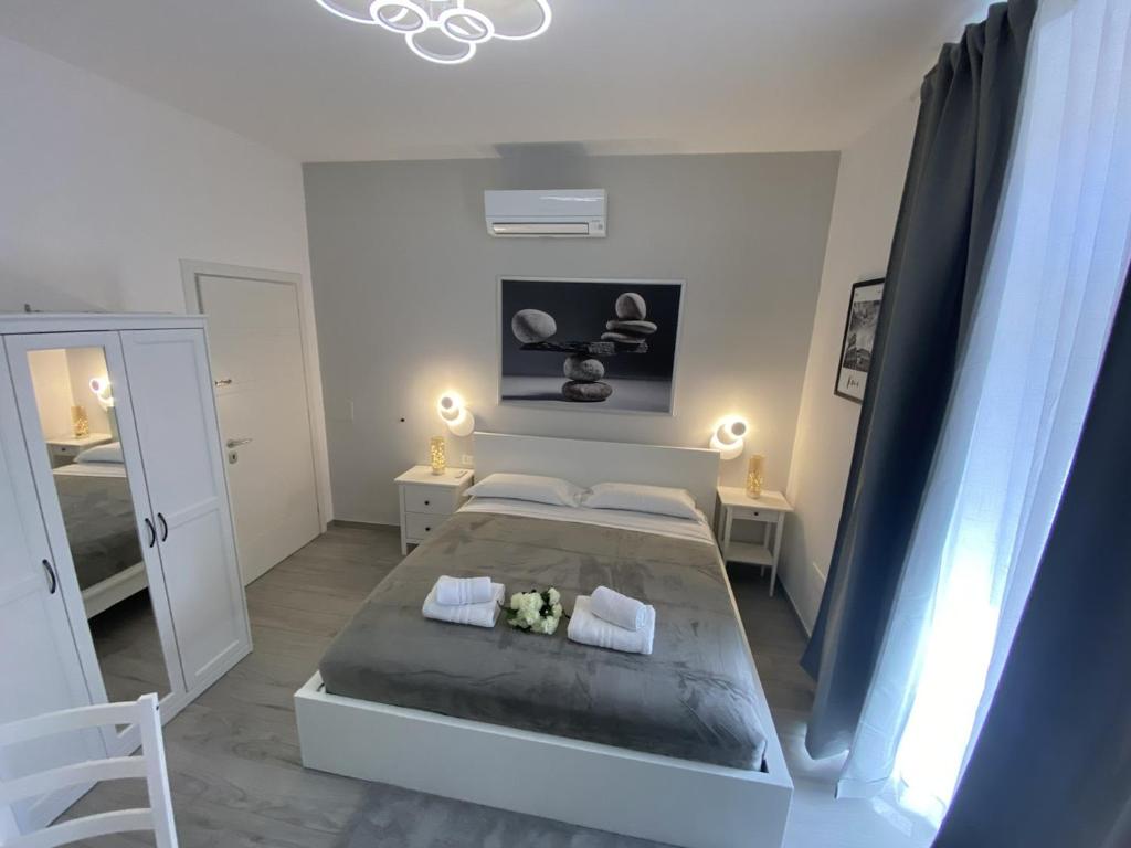 a bedroom with a large bed and a mirror at Soft rooms ROMA CENTRO Guest house affittacamere in Rome