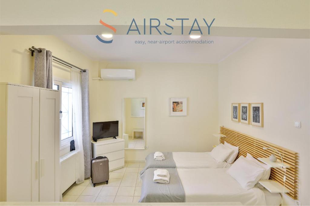 TV a/nebo společenská místnost v ubytování Nautilus Apartments Airport by Airstay