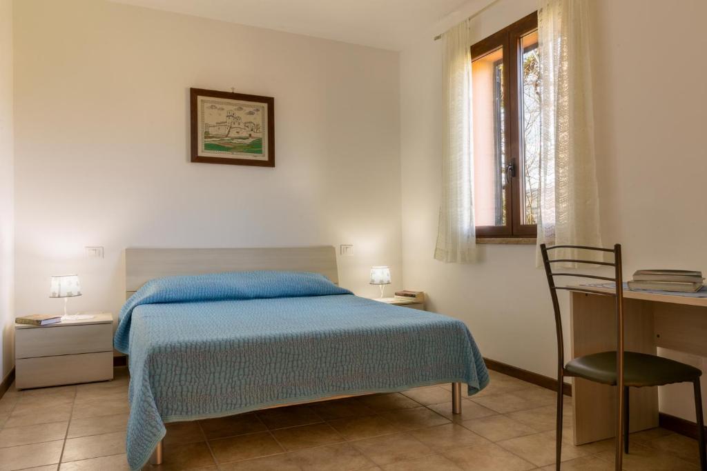 Posteľ alebo postele v izbe v ubytovaní Relais Parco Del Subasio