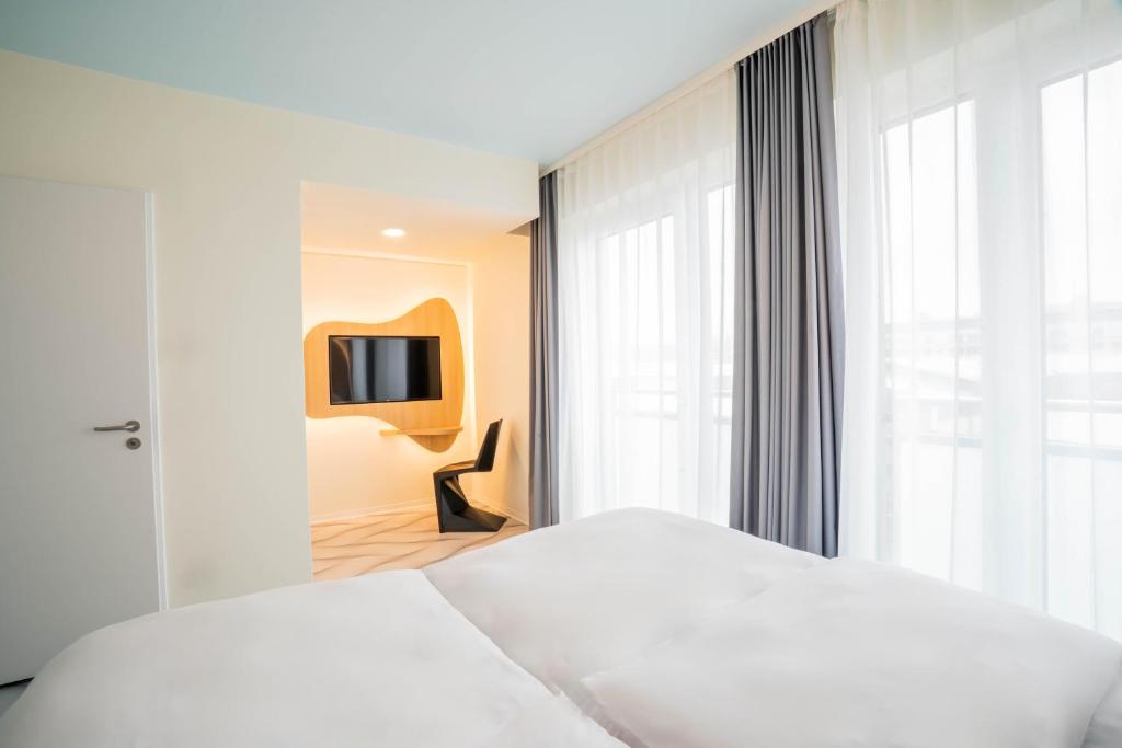 Postel nebo postele na pokoji v ubytování Prize by Radisson, Dresden Mitte