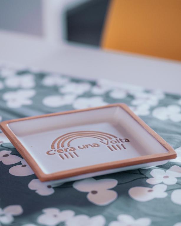 a plate sitting on top of a table at C'era una Volta Apartments in Bisceglie