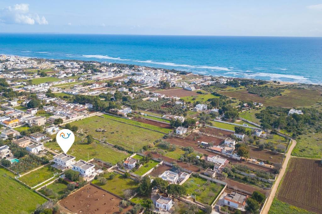 an aerial view of a town next to the ocean at Le Bianche Apartment 4 close to the beach - Happy Rentals in San Pietro in Bevagna