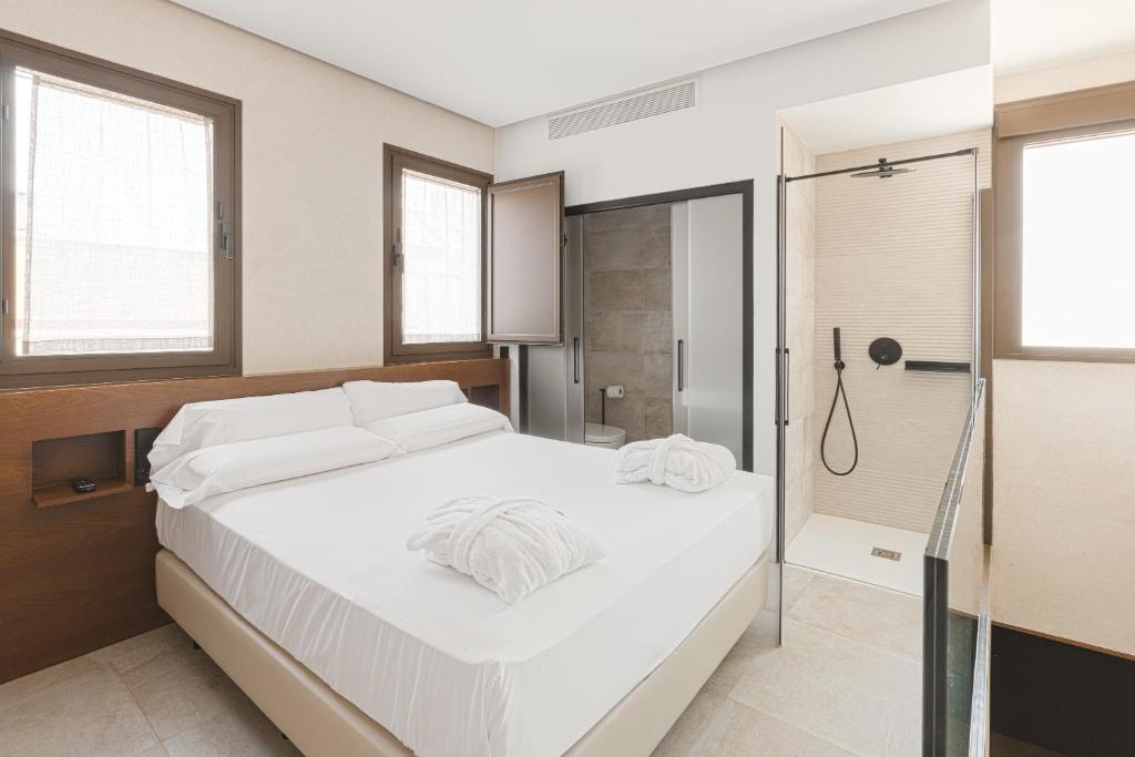 Postel nebo postele na pokoji v ubytování Casa Señorial del Siglo XVIII