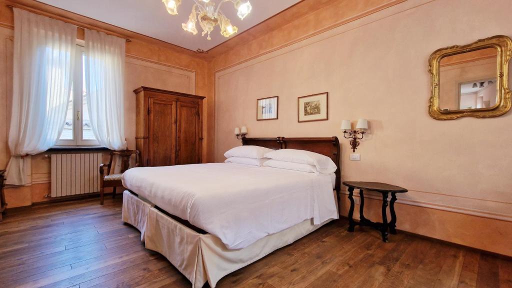 Postel nebo postele na pokoji v ubytování Relais Vimercati
