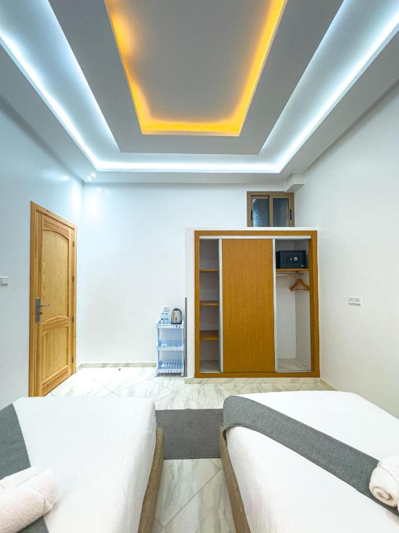 Postel nebo postele na pokoji v ubytování Hotel apartment america