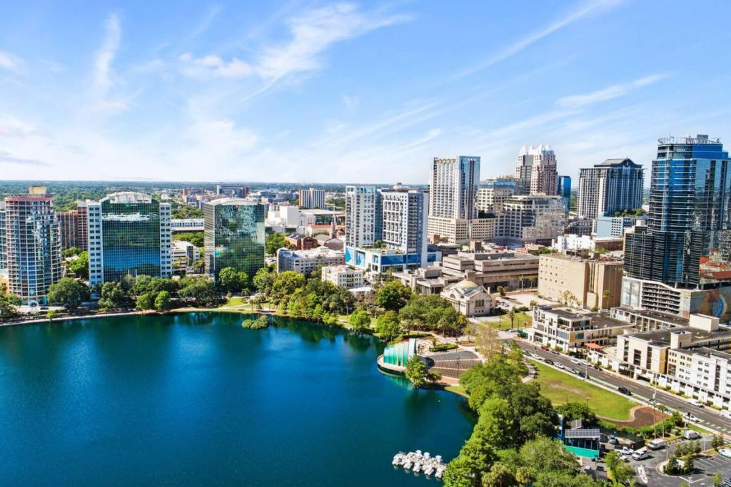 an aerial view of a city with a lake at Stylish Urban Retreat Steps from Lake Eola in Orlando