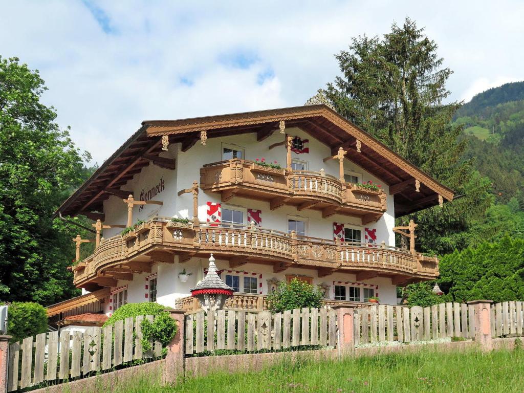 a house with a wooden fence in front of it at Apartment Sonneck - MHO554 by Interhome in Ramsau im Zillertal