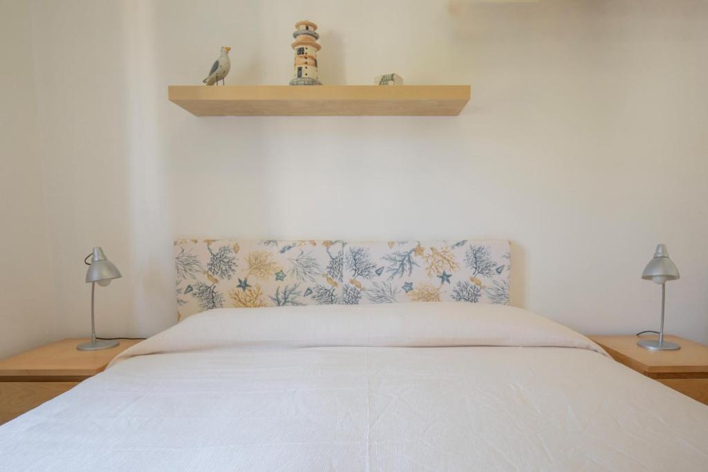 Postel nebo postele na pokoji v ubytování Lacona Mare - HelloElba
