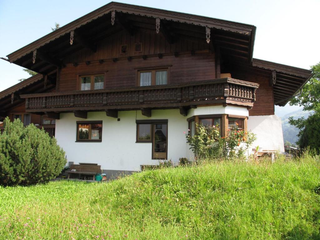 a house with a wooden roof on a hill at Apartment Josef - ZAZ590 by Interhome in Aschau