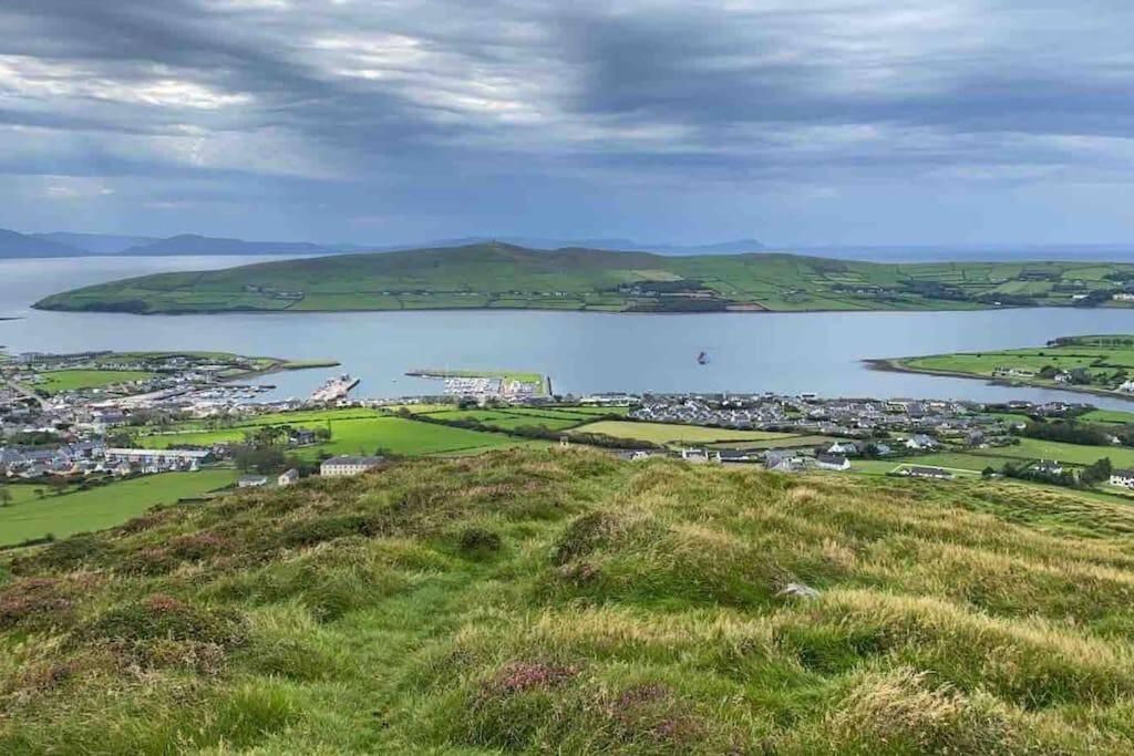 a view of a large body of water from a hill at Beautiful Modern Home In Dingle 5 min walk to town in Dingle