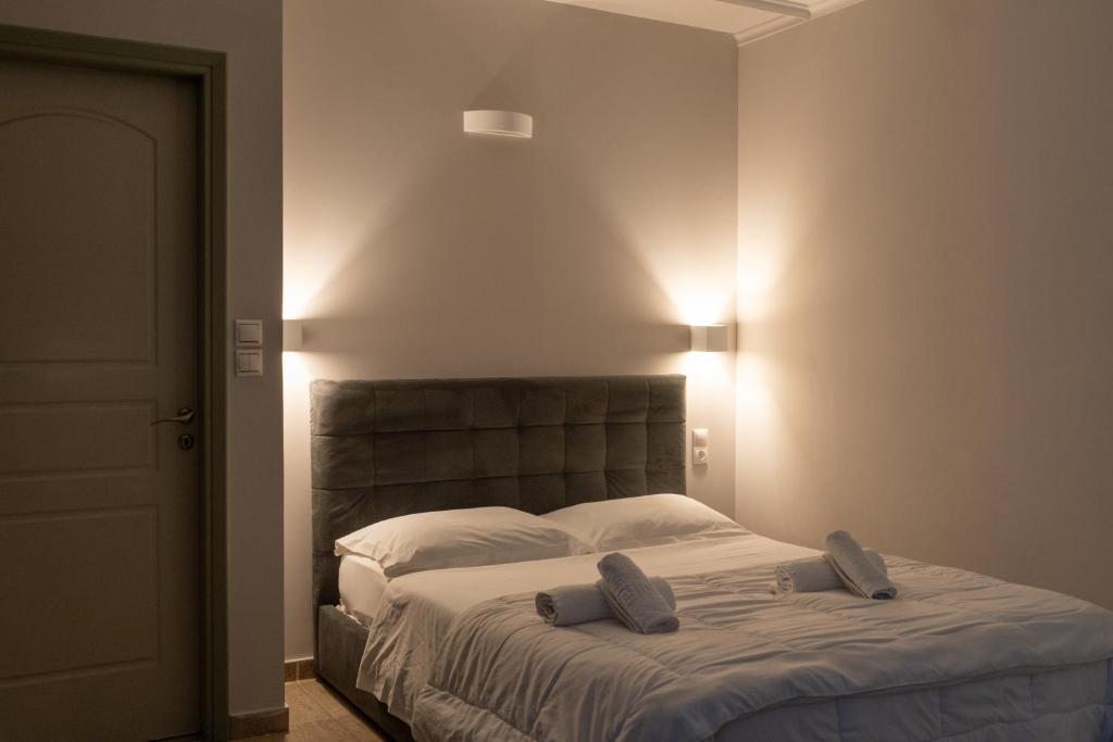a bedroom with a bed with two pillows on it at CENTRAL Studio - Fully equiped. Ideal for couples in Patra