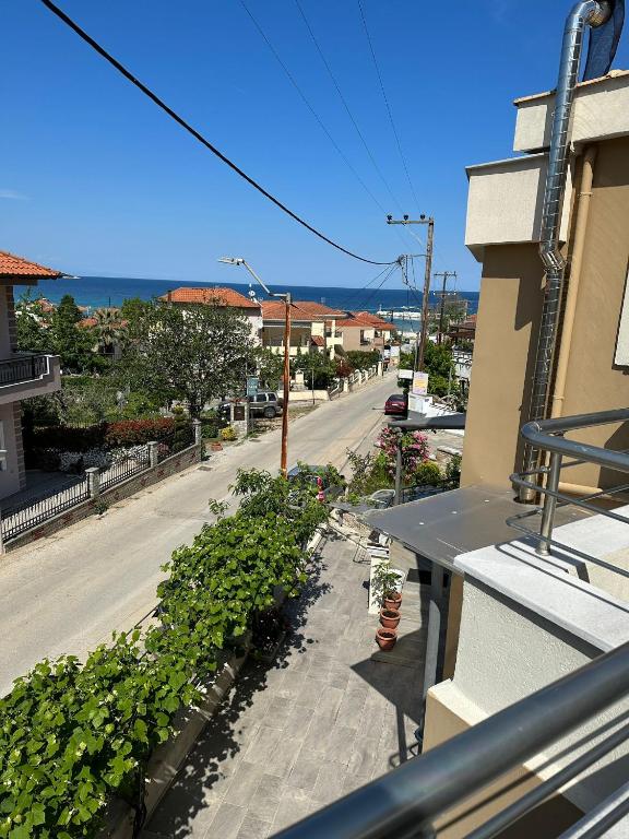 a view of a street from the balcony of a building at Lajes Apartment in Skala Potamias