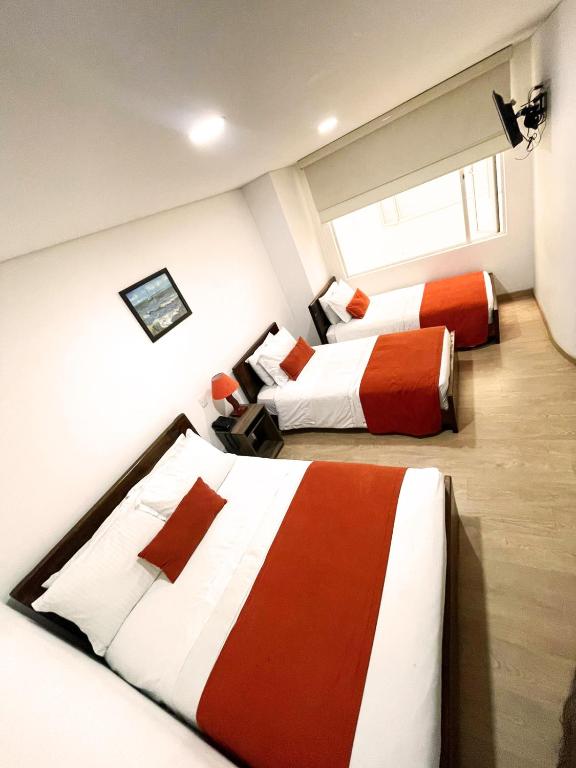 Postel nebo postele na pokoji v ubytování Hotel Portal de los Andes