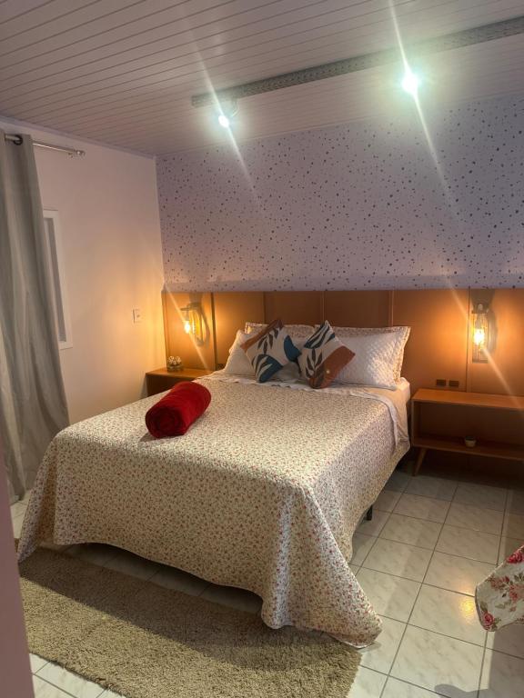 En eller flere senge i et værelse på La Vita hospedaria quarto verde