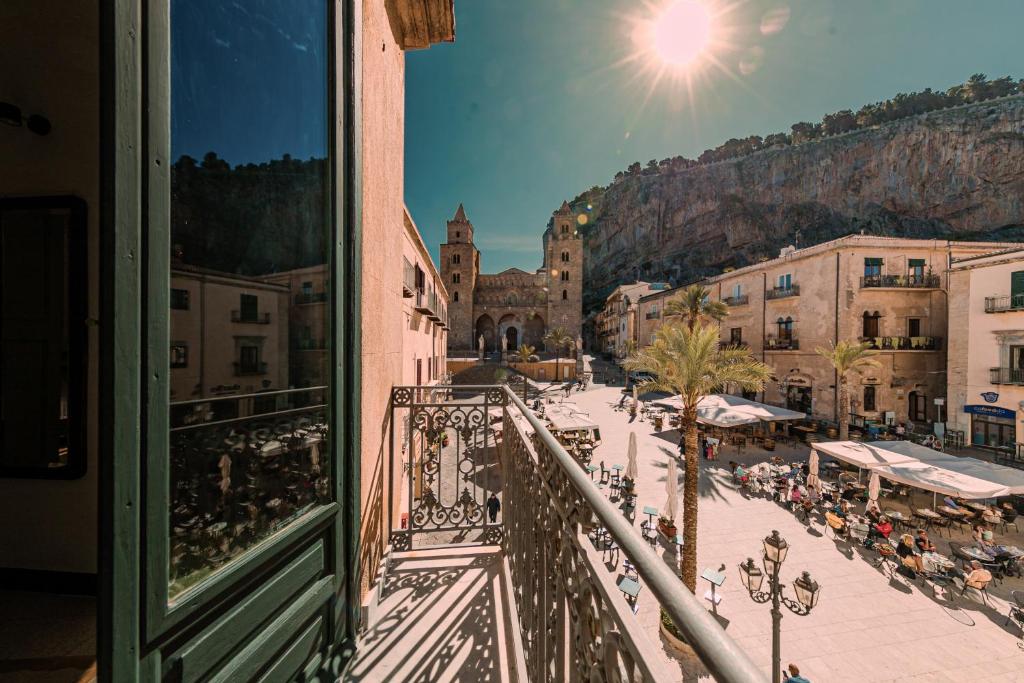 a view from a balcony of a city with a street at Palazzo Villelmi in Cefalù
