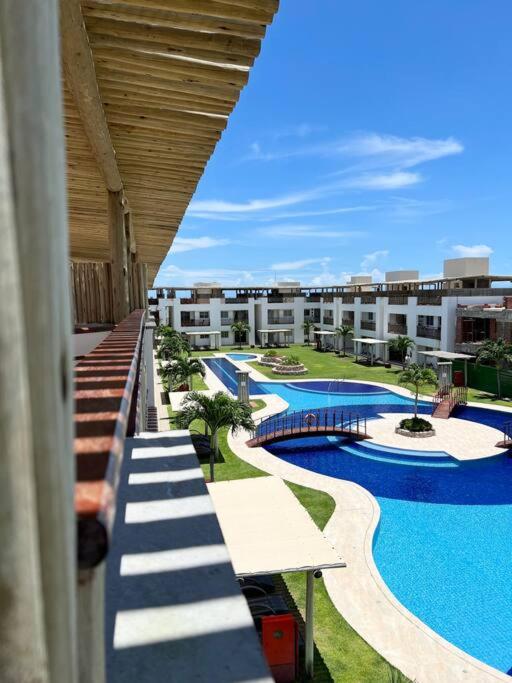 a view of a resort with a swimming pool at Flat Canoa Quebrada in Aracati