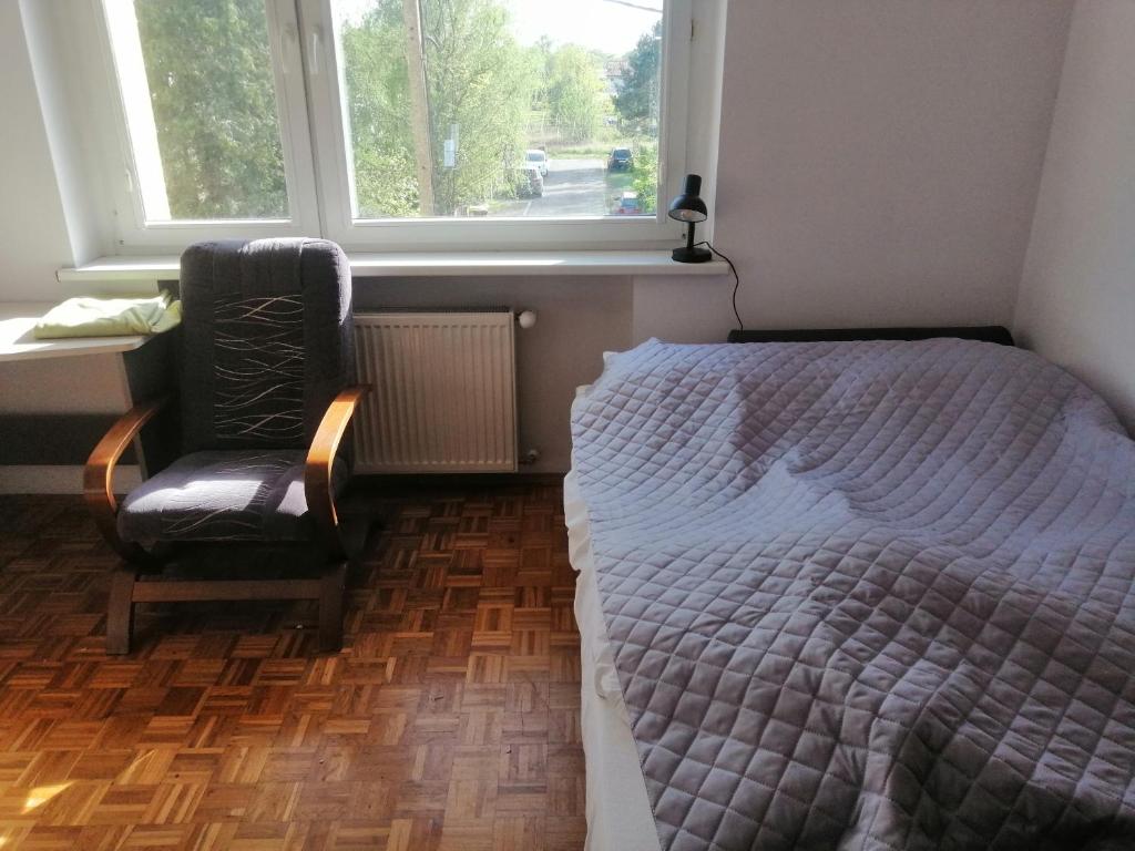 Postel nebo postele na pokoji v ubytování Willa Malbork