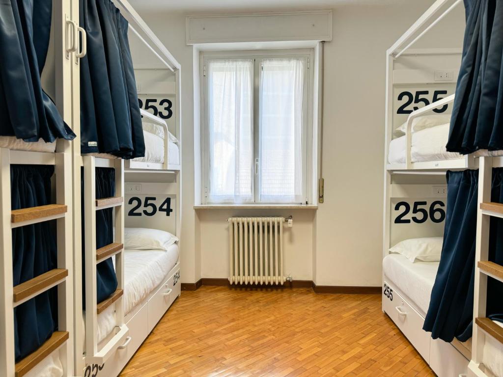 Postel nebo postele na pokoji v ubytování Bovisa Urban Garden