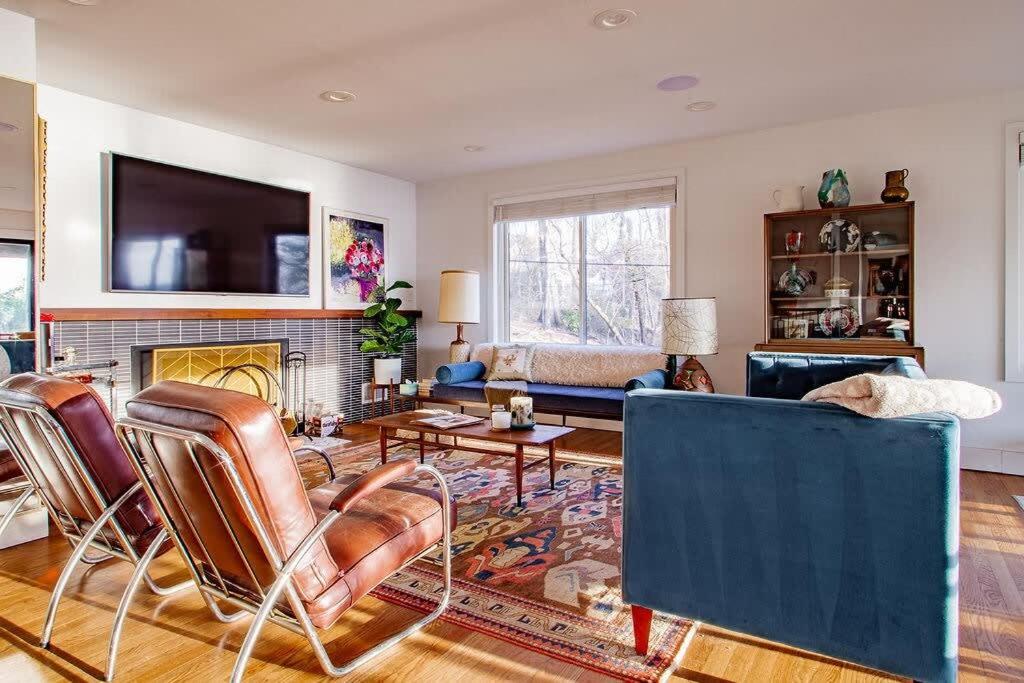 a living room with a couch and a fireplace at Peace on the Potomac RiverViews NationalHarbor in Fort Washington