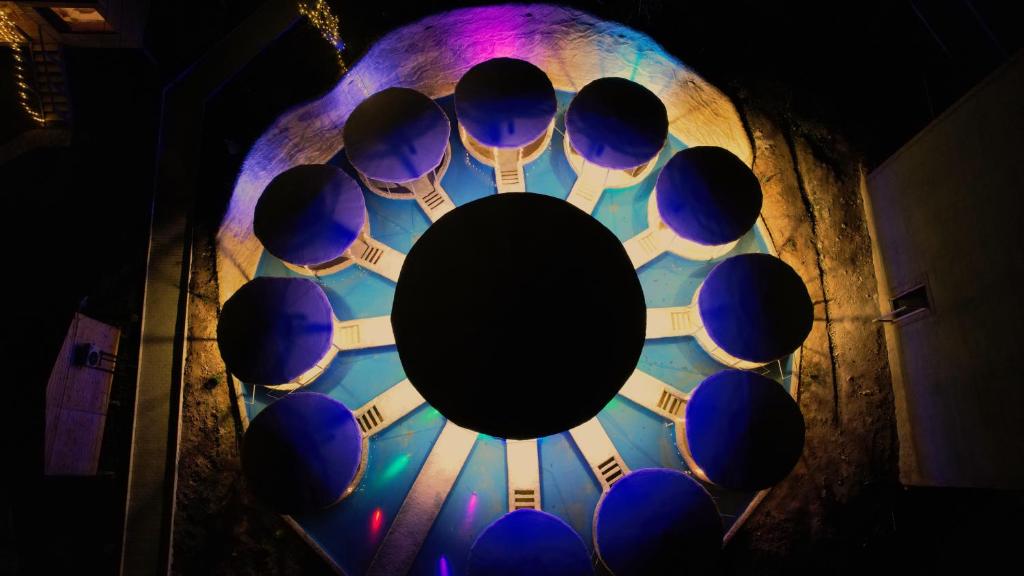 a close up of a clock with blue spheres at Villaggio Mirzaani Resort in Sighnaghi