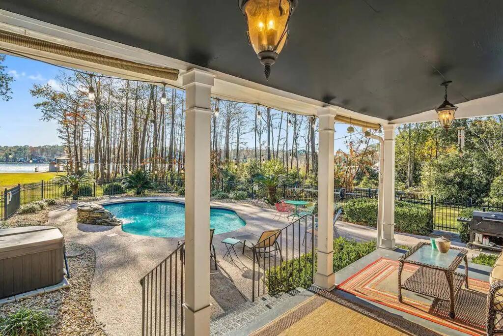 an estate with a swimming pool and a patio at Cypress Grove - Dog River in Mobile