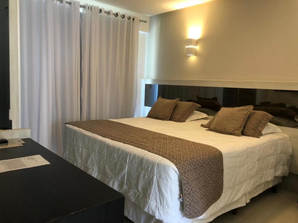 Cama ou camas em um quarto em Reserva Praia Hotel
