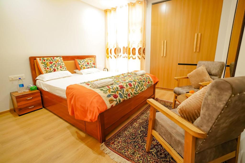 Tempat tidur dalam kamar di Zaabeel Villa Kashmir