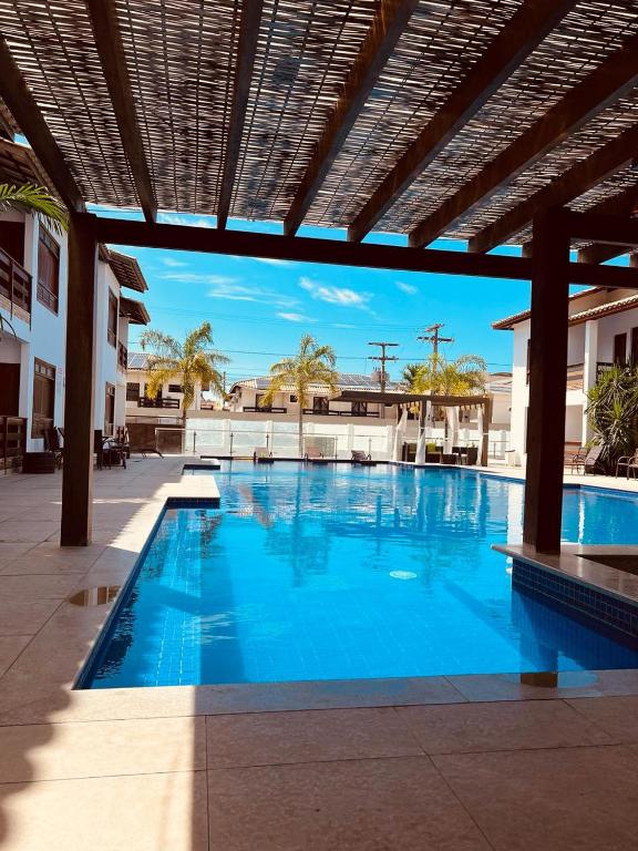Bazén v ubytování Hotel Encantos de Itaperapuã nebo v jeho okolí