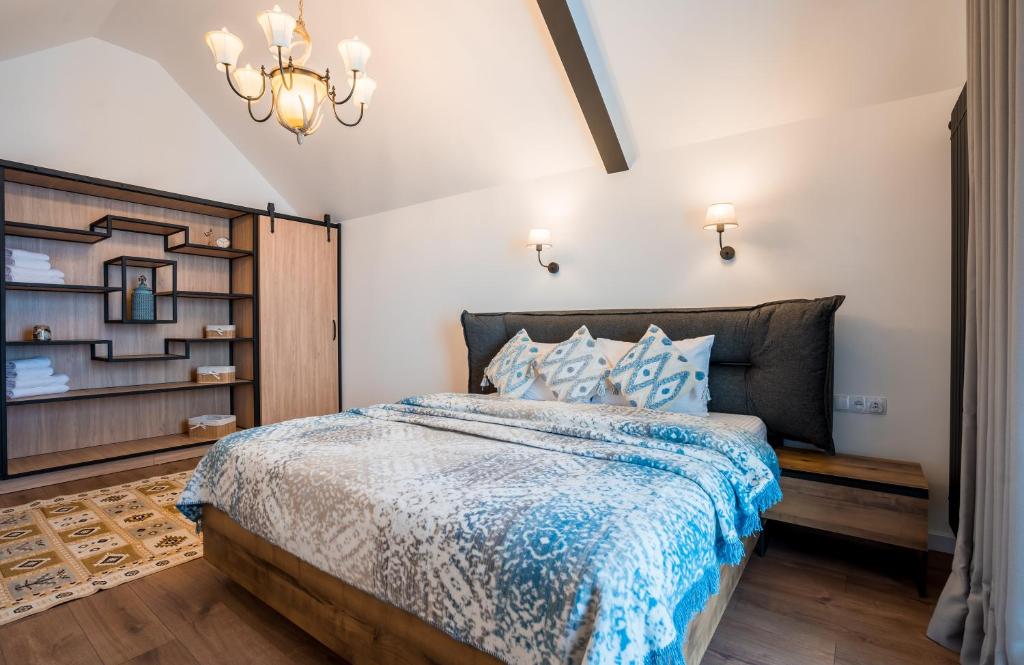 Postel nebo postele na pokoji v ubytování New Gudauri Apartments