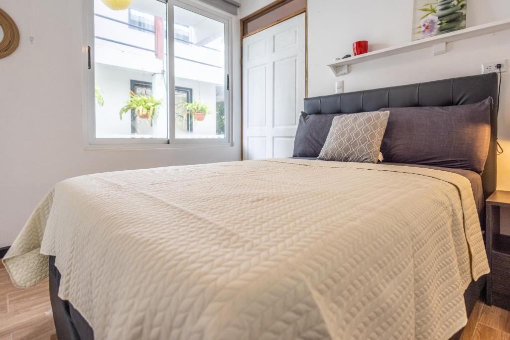 Postel nebo postele na pokoji v ubytování BUDDA HOME