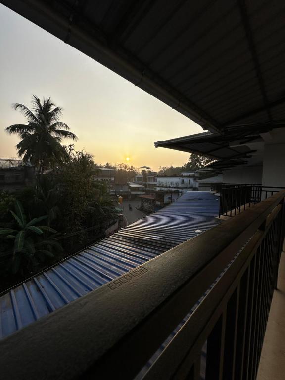 a view from the roof of a building with the sunset at VALIYAVEETTIL INN in Irikkūr