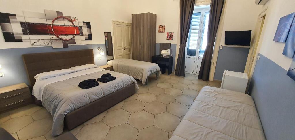 Postel nebo postele na pokoji v ubytování B&B Maricentro