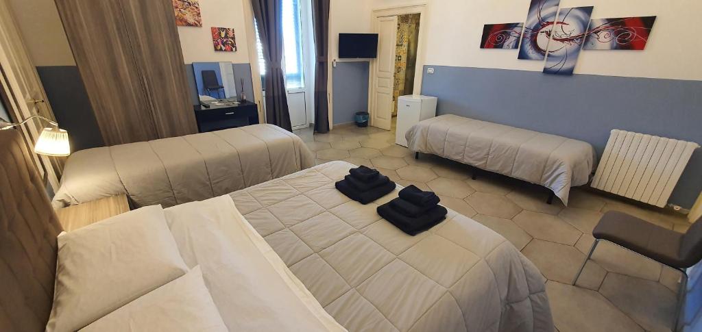 Postel nebo postele na pokoji v ubytování B&B Maricentro