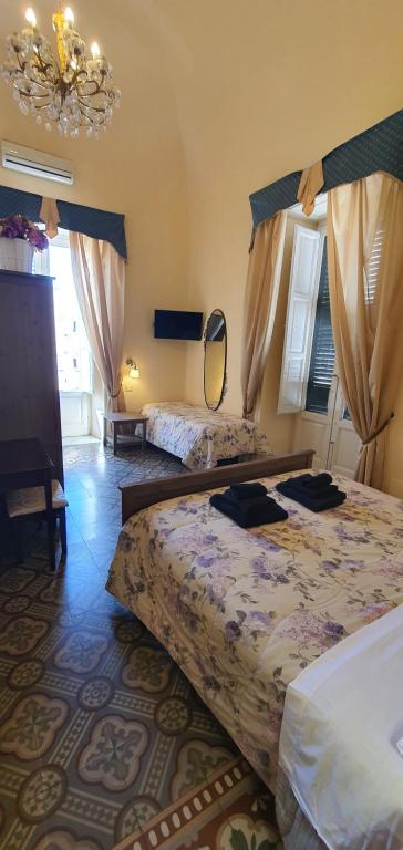 Postel nebo postele na pokoji v ubytování B&B Maricentro