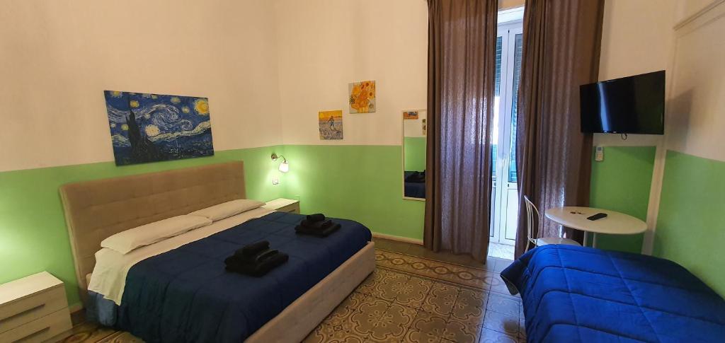 Postel nebo postele na pokoji v ubytování B&B Maricentro