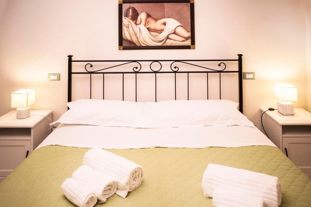Postel nebo postele na pokoji v ubytování Diddy Maison