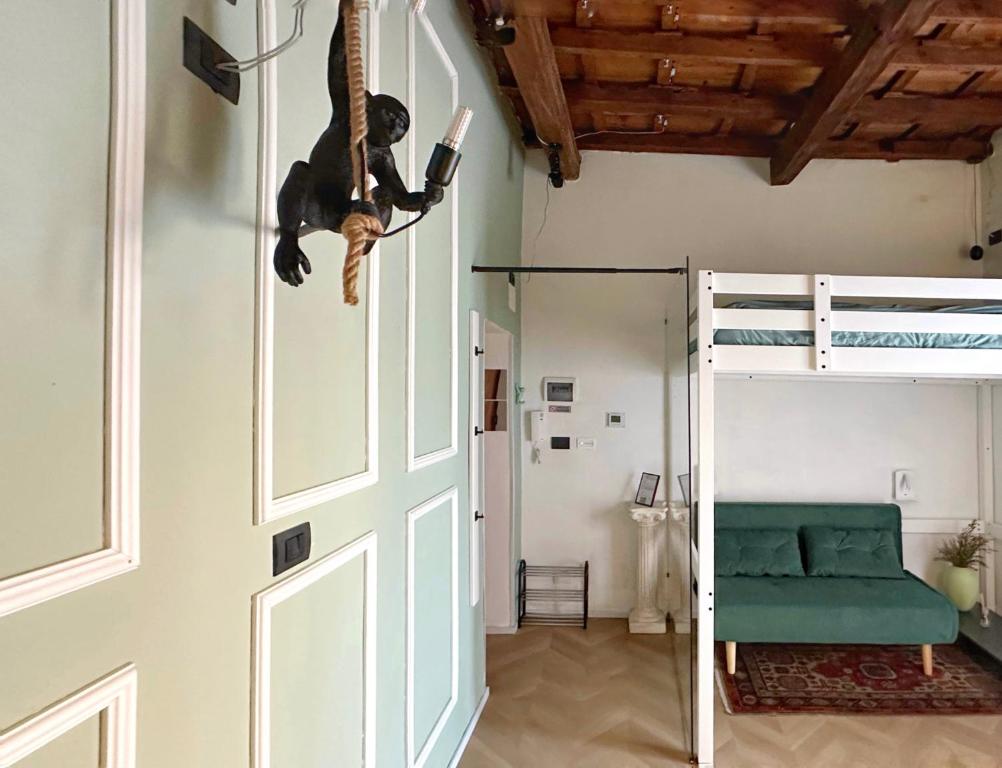 a monkey hanging from the ceiling of a room at Loft Biagio50 in Centro in Ferrara