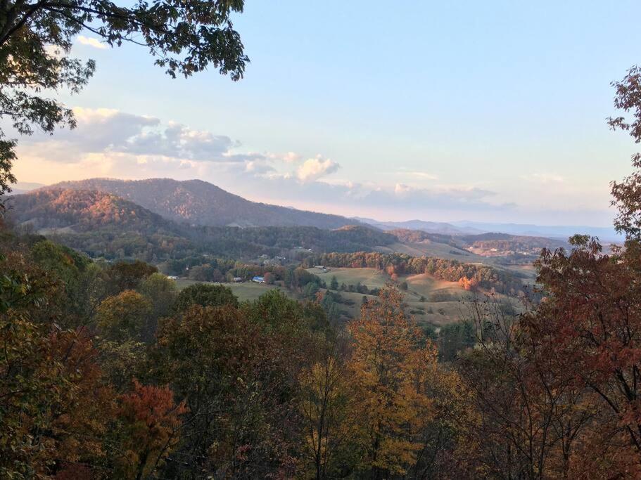 a view of a valley with trees and mountains at Top of the Line Asheville Mountain Cabin in Leicester