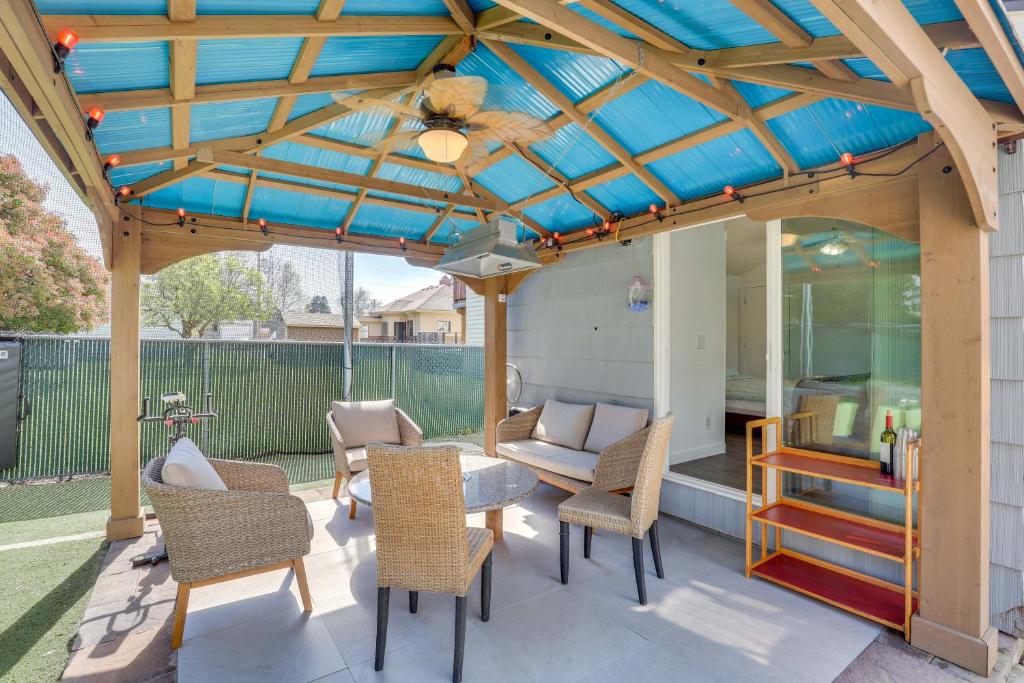a pergola with chairs and a table on a patio at Family-Friendly Renton Retreat 15 Mi to Seattle! in Renton