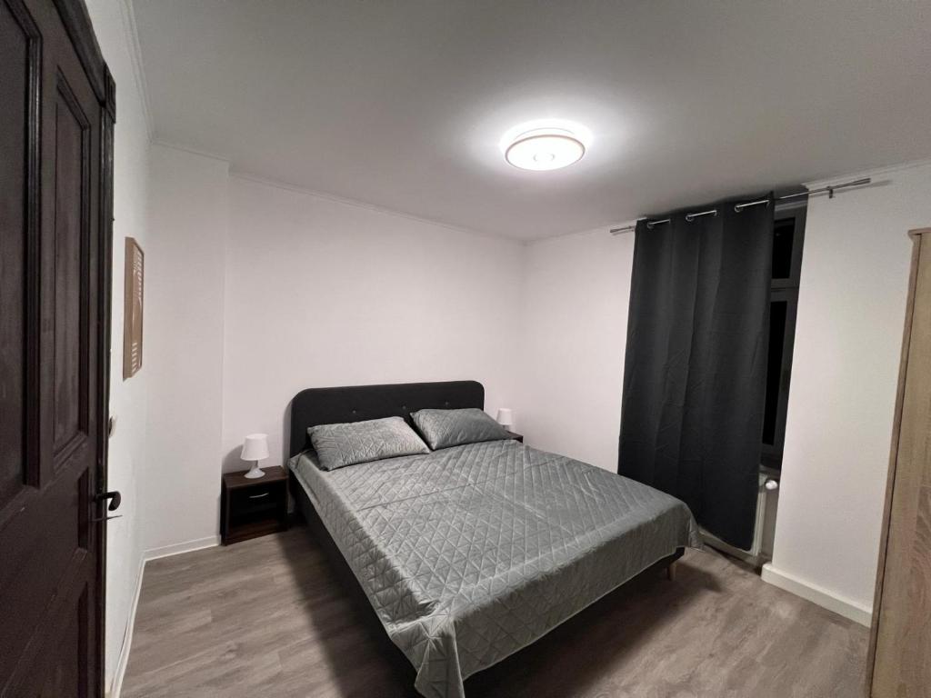 Säng eller sängar i ett rum på Gera Apartment EG