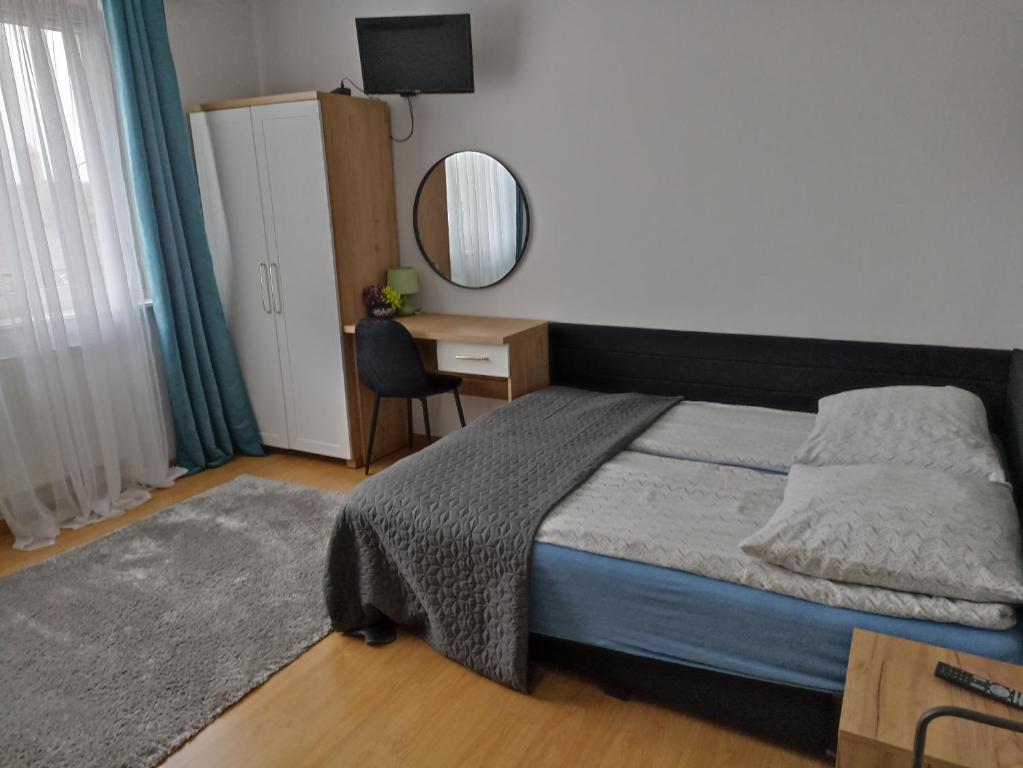 Posteľ alebo postele v izbe v ubytovaní Pokoje AGA