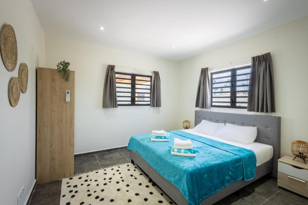 Postel nebo postele na pokoji v ubytování Villa Monrel Mambo Beach