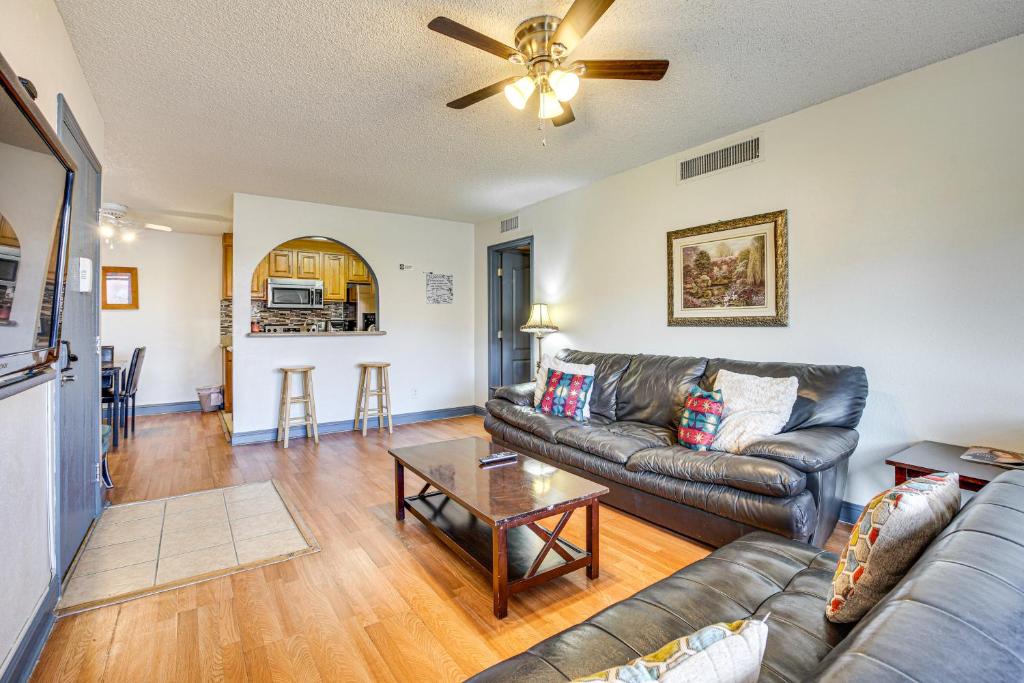 a living room with a couch and a table at WFH-Friendly Las Vegas Condo 2 Mi to Strip! in Las Vegas