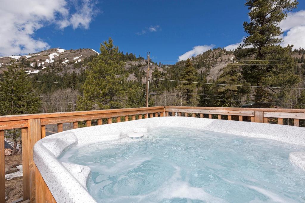 a jacuzzi tub on the deck of a house at Mineral Springs 3 BR w Hot tub Available in Alpine Meadows in Olympic Valley