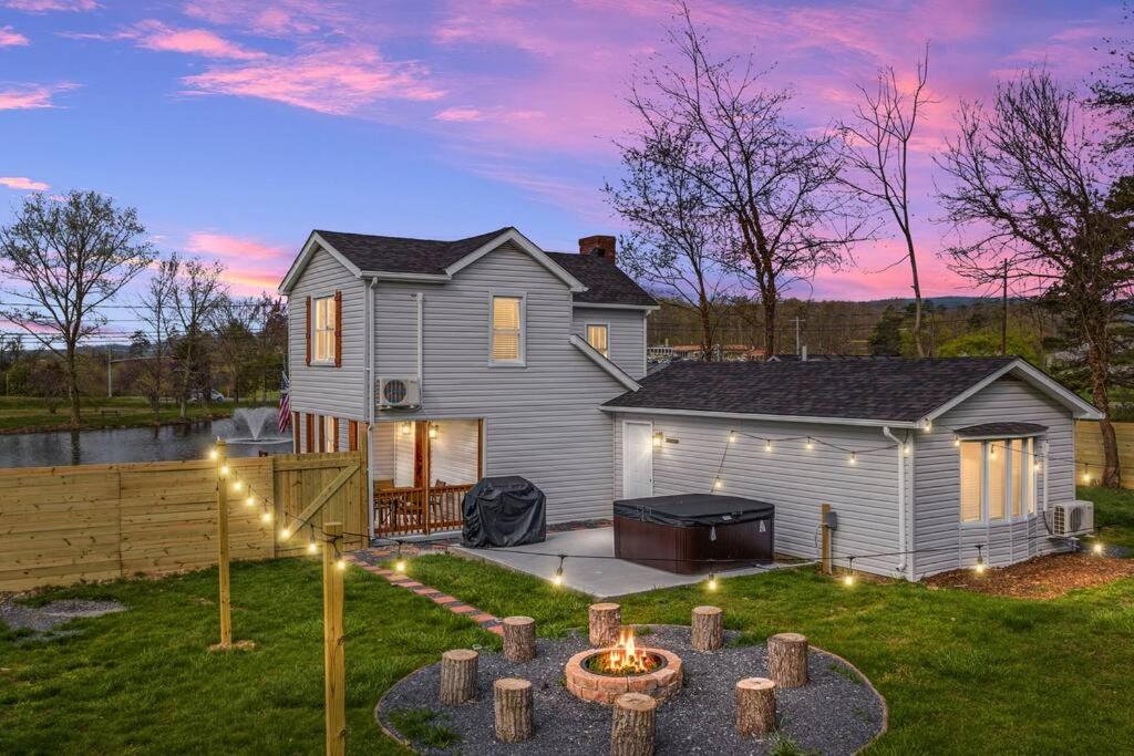 Pondview 4BR Cabin-Walk to Caverns, Hot Tub, Wi-Fi photo