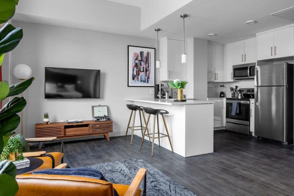 a kitchen and living room with a couch and a table at Sensational Studio Near Great American Ball Park in Cincinnati