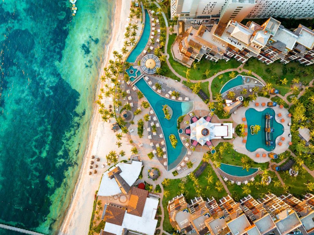 an aerial view of a resort next to the ocean at Villa del Palmar Cancun Luxury Beach Resort & Spa in Cancún