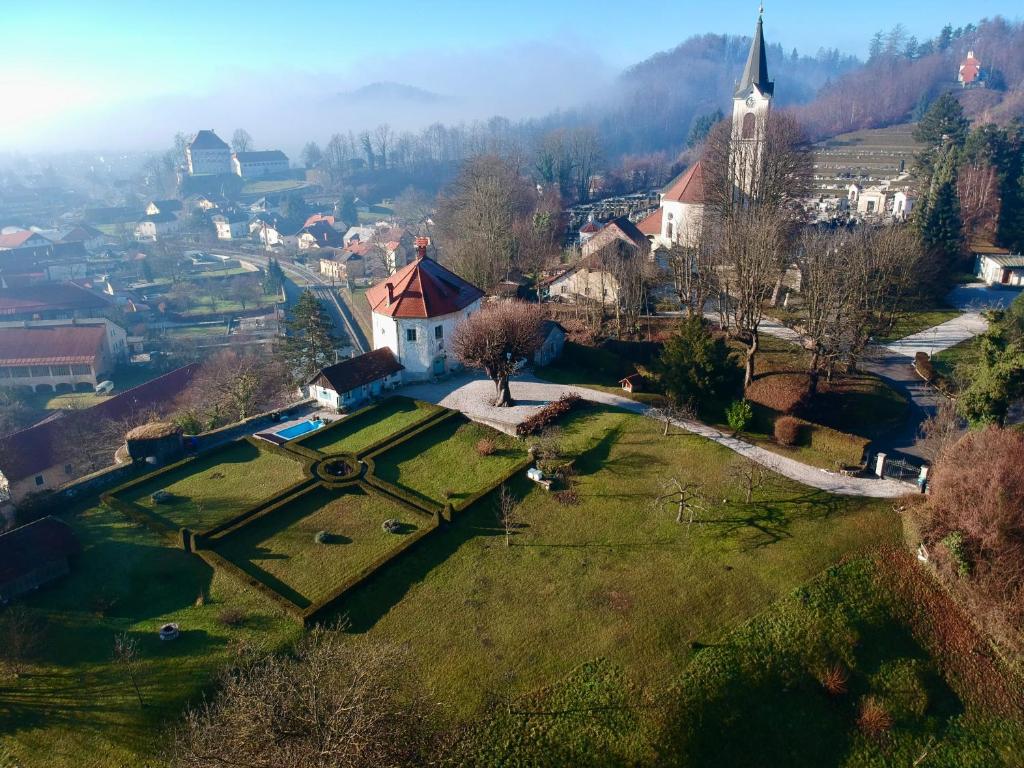 an aerial view of a small village with a church at Medieval Castle in Kamnik City Center - Trutzturn in Kamnik