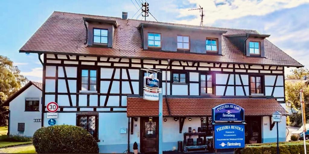 a large house with a brown roof at CASA RUSTICA Bodensee Ferienwohnungen in Stetten